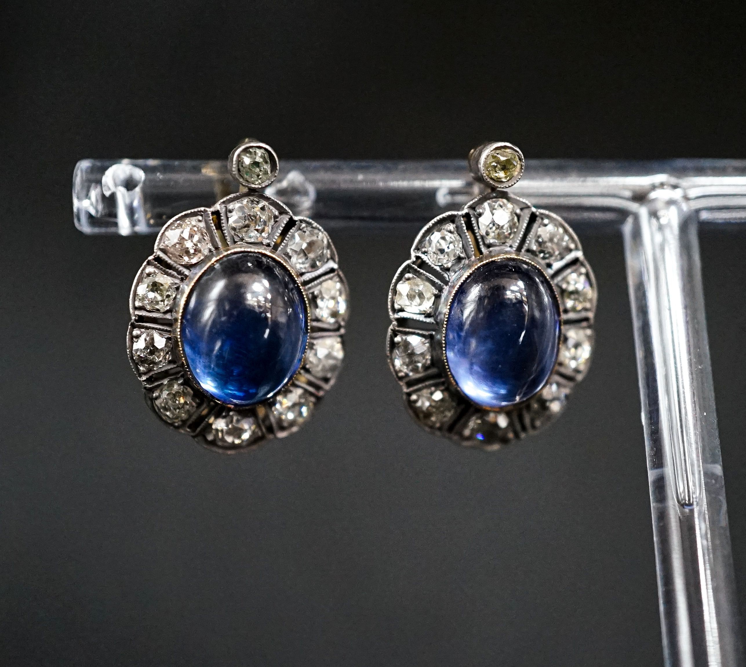 A pair of 19th century gold and silver, cabochon sapphire? and diamond set oval cluster earrings, set with old mine cut diamonds, 20mm, gross 6.9 grams.
